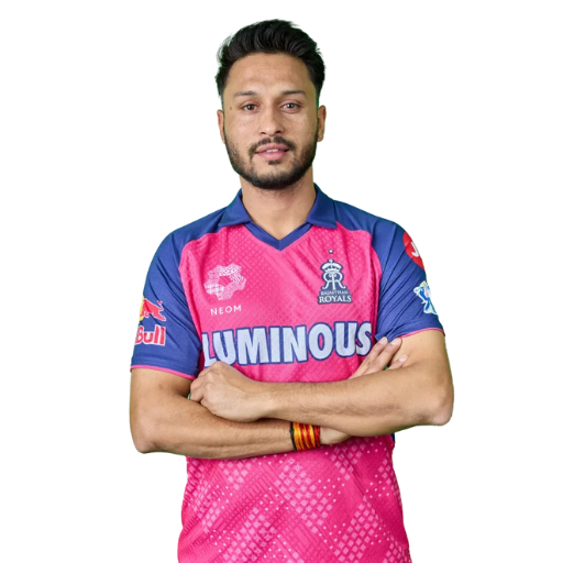 Akash Madhwal posing in Rajasthan Royals jersey 2025