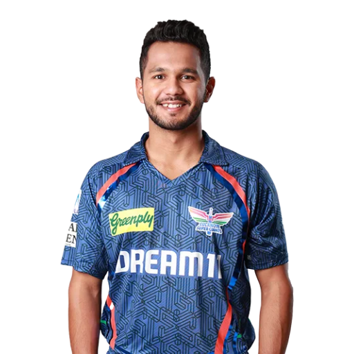 Aryan Juyal posing in lucknow super giants jersey