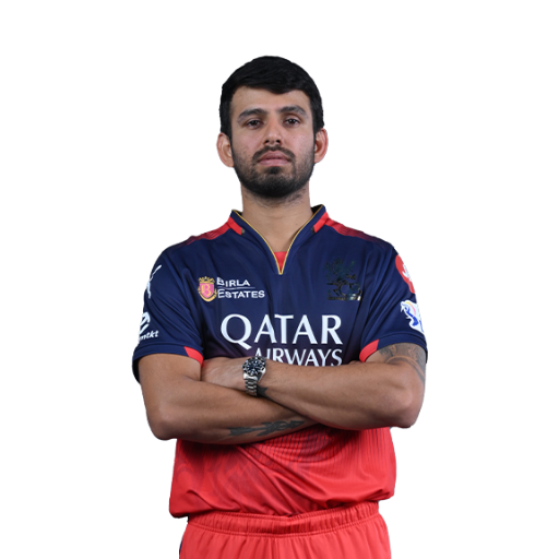 Jitesh Sharma posing in Royal Challengers Bengaluru jersey 2025