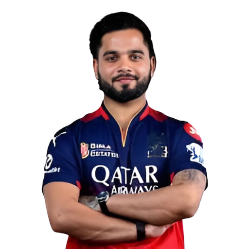 Suyash Sharma posing in Royal Challengers Bengaluru jersey 2025