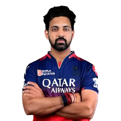 Swapnil Singh posing in Royal Challengers Bengaluru jersey 2025