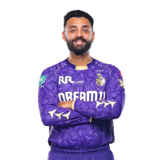 Varun Chakaravarthy posing in Kolkata Knight Riders jersey