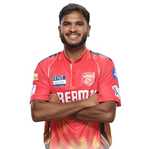Vijaykumar Vyshak posing in punjab kings jersey 2025
